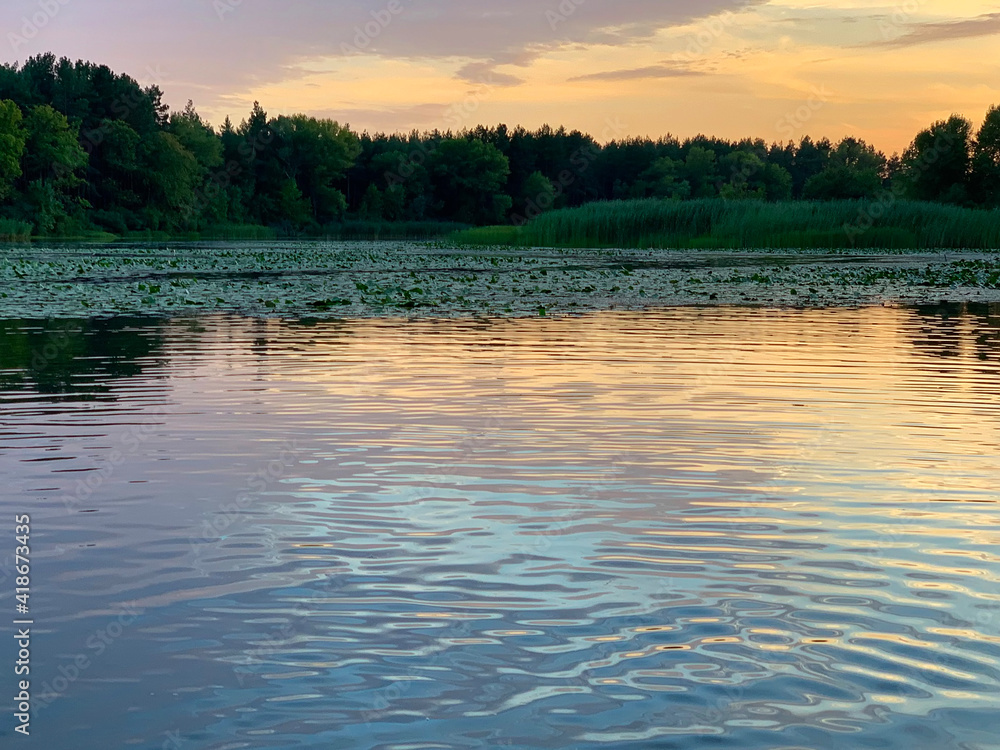 Sunset on the floodplains in Svitlovodsk, Kirovograd region, Ukraine, kayaking on the Dnieper river. Soft selective focus, mobile photo, long exposure