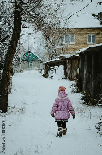child playing with snow