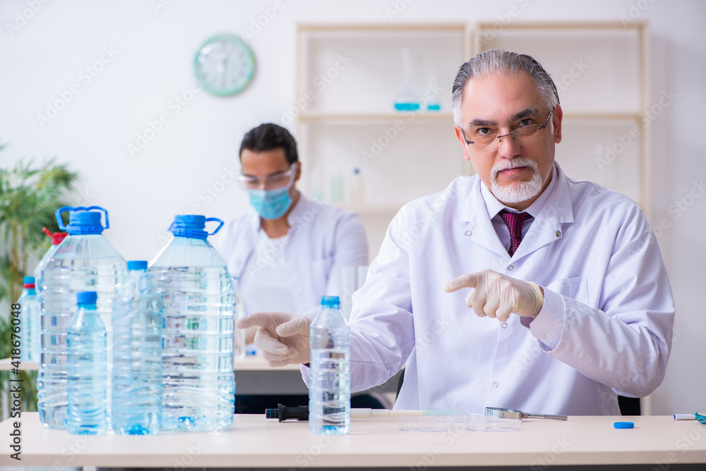 Two chemists working in the lab Two chemists working in the lab