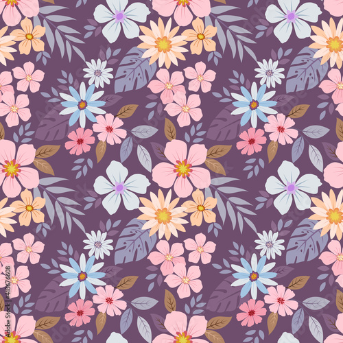 Colorful hand drawn flowers on purple color background seamless pattern design. can use for fabric textile wallpaper background.