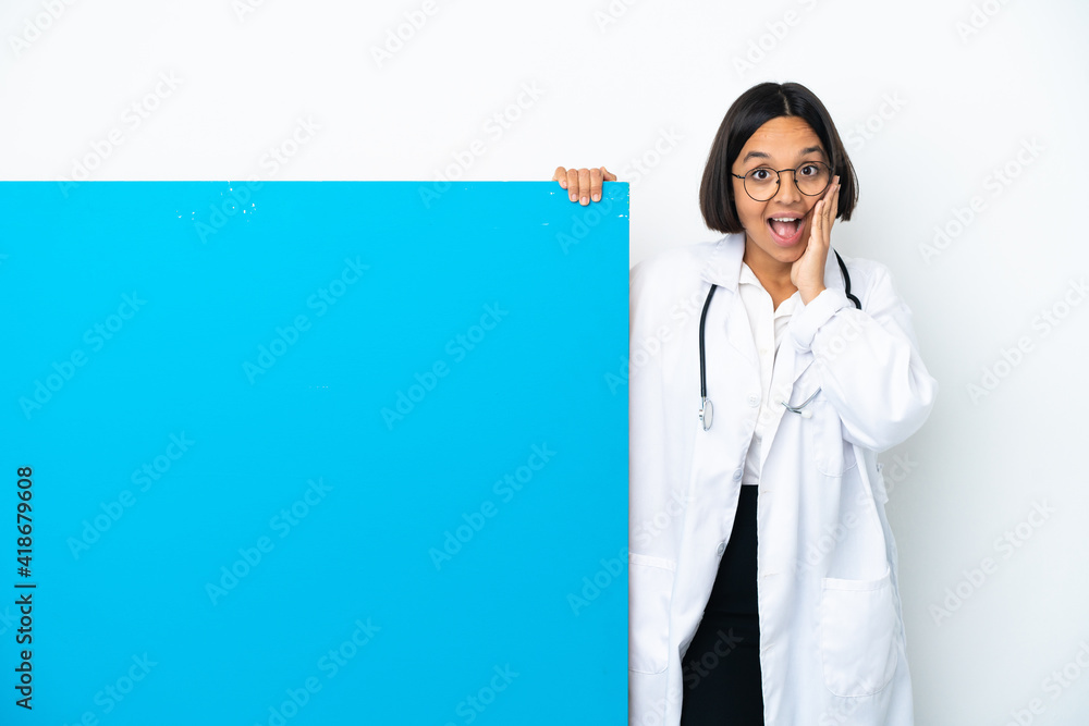 Young mixed race doctor woman with a big placard isolated on white background with surprise and shocked facial expression Young mixed race doctor woman with a big placard isolated on white background with surprise and shocked facial expression