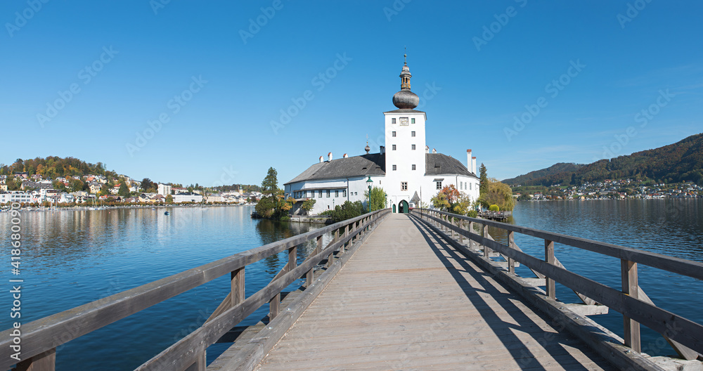 wooden footbridge to Schloss Orth castle tourist destination, lake Traunsee, Salzkammergut