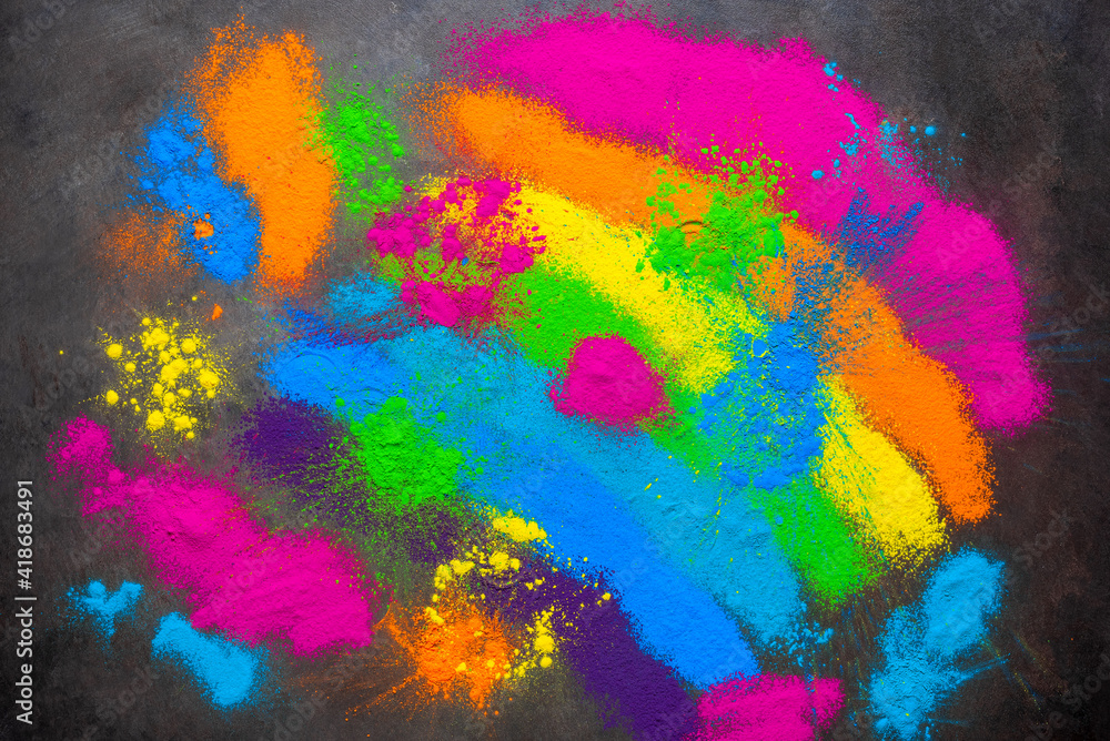 Holi colored powders background. Holi traditional festival. View from above.