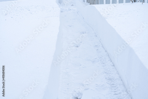 Snow plow track in high snow levels in winter