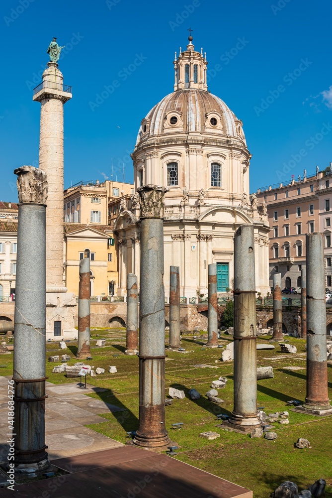 Perspective showing ancient roman pillars in front of catholic cathedral dome in Rome