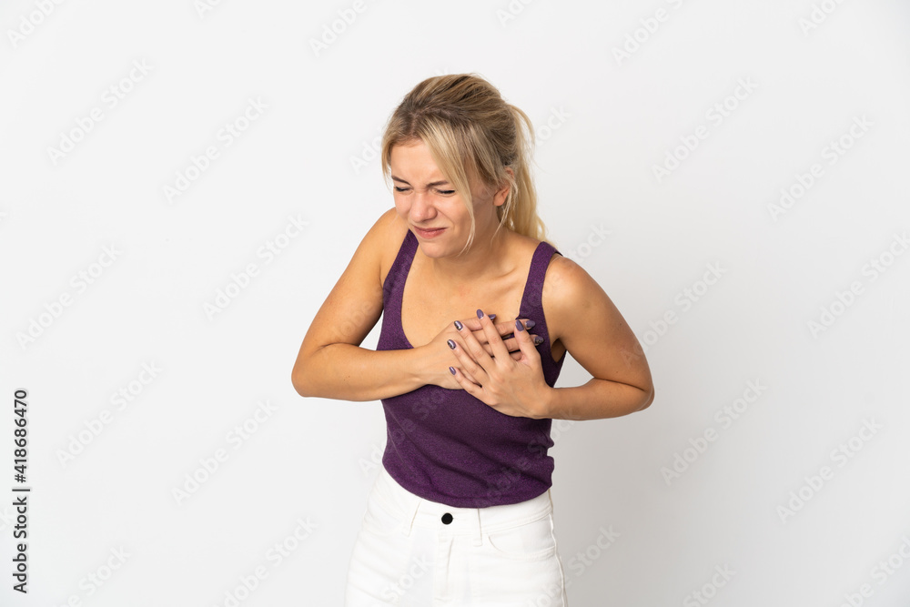 Young Russian woman isolated on white background having a pain in the heart Young Russian woman isolated on white background having a pain in the heart