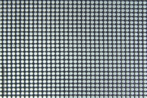 Abstract background with rhinestones. Factory fabric with rhinestones. Horizontal orientation