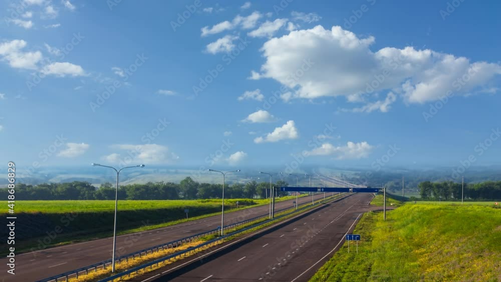 asphalt road under a cloudy sky, transportation time lapse scene asphalt road under a cloudy sky, transportation time lapse scene