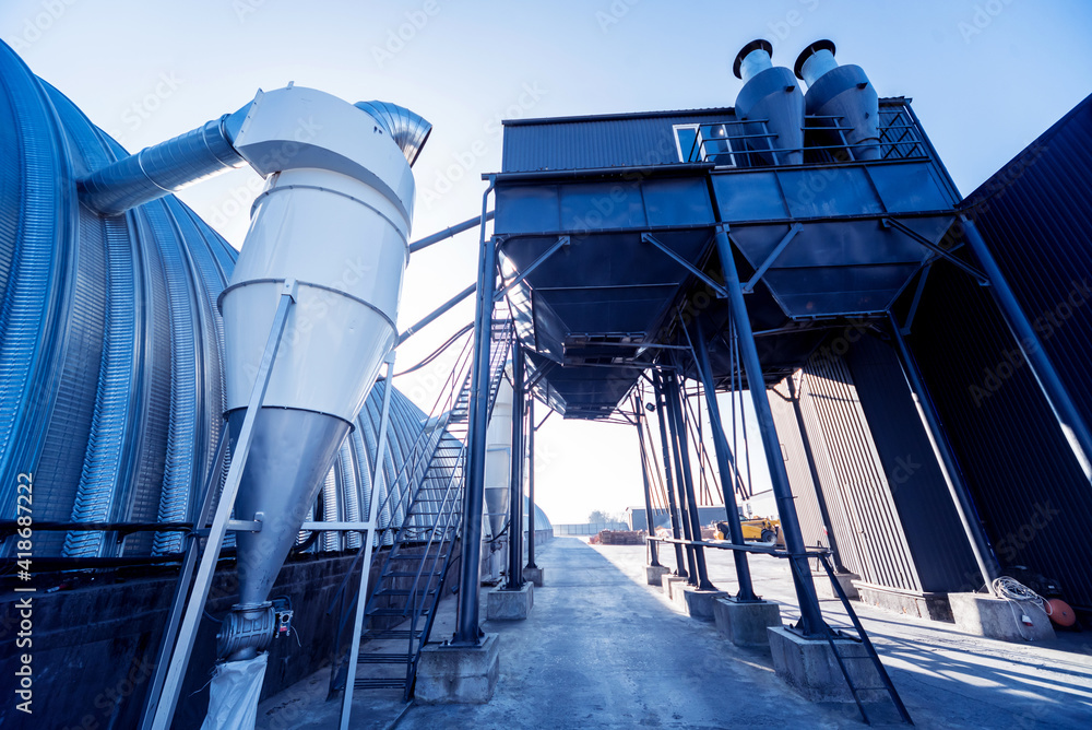 Naklejka premium Industrial metallic construction at background with clear sky