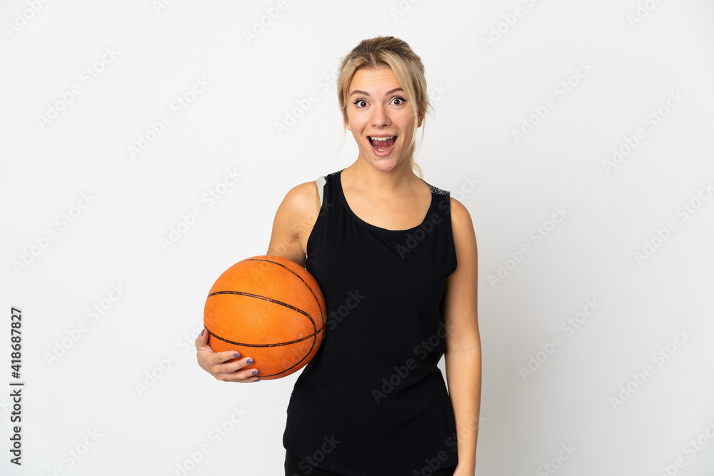 Young Russian woman playing basketball isolated on white background with surprise facial expression