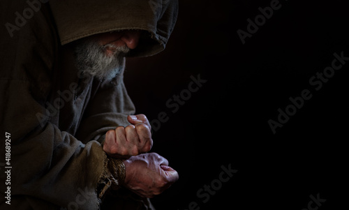 shackled beggar with middle ages photo