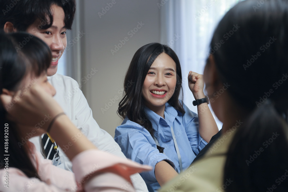 Young business people stack hands with coworker team while group teamwork meeting in conference room Young business people stack hands with coworker team while group teamwork meeting in conference room