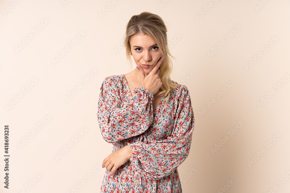 Blonde woman over isolated background thinking Blonde woman over isolated background thinking
