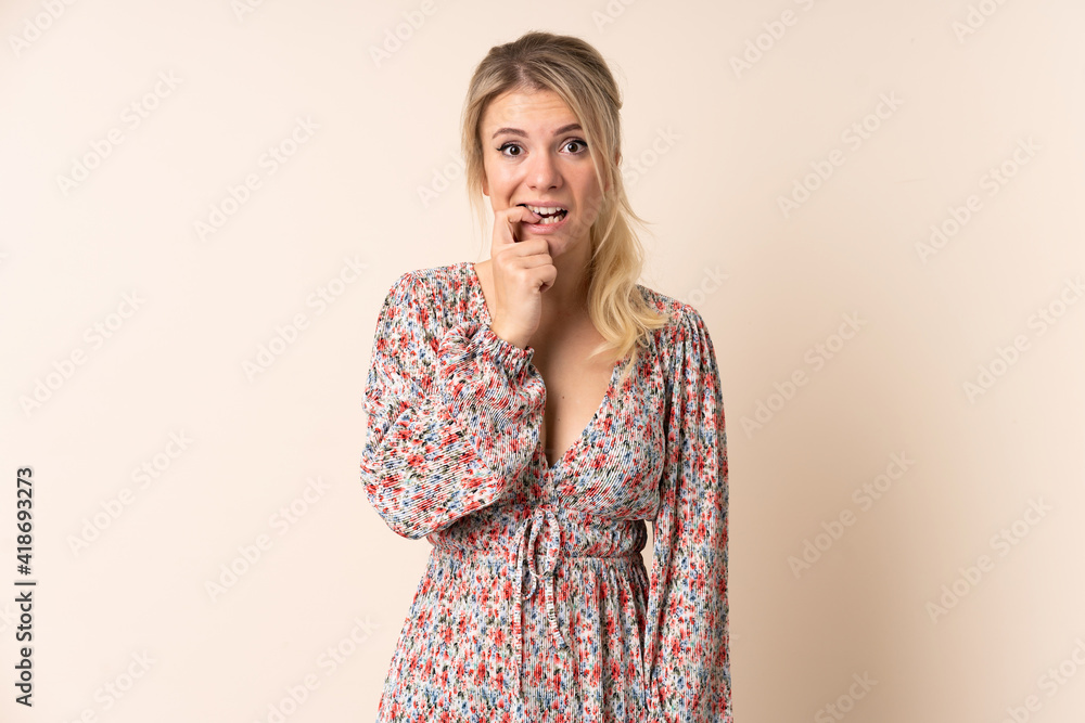 Blonde woman over isolated background nervous and scared Blonde woman over isolated background nervous and scared