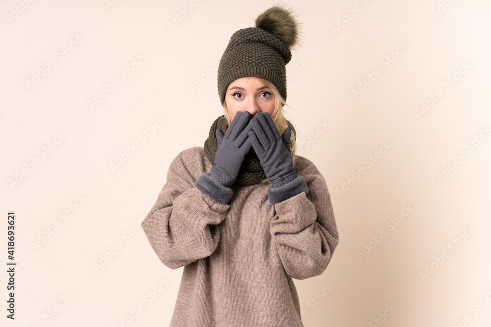 Young woman with winter hat over isolated background with surprise facial expression Young woman with winter hat over isolated background with surprise facial expression