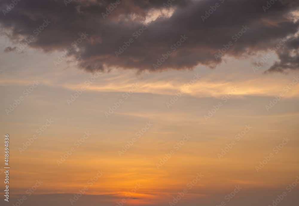 dramatic dark clouds twilight or dawn, aerial view of the color of the season change. yellow and orange colorful sky. romantic beautiful sky in the spring season. heavenly sky landscape background