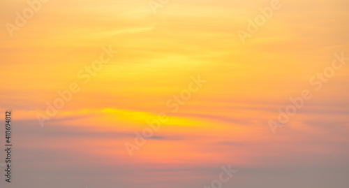 golden sunset or sunrise at the deep dark ocean. aerial view of sundown and up to the sea. yellow and orange colorful sky. romantic beautiful sky in the spring season. heavenly sky. new beginning © phoomrat