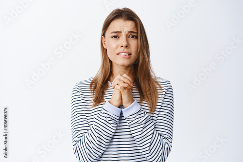 Obraz na plátně Image of nervous and miserable woman begging for help, pleading you, saying plea