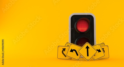 Red traffic light with road signs