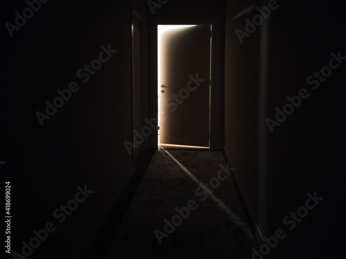 Canvas Print Door to the light in a dark corridor