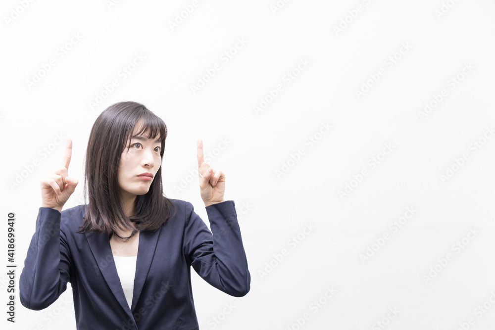 Woman standing with her index finger up (gesture) Woman standing with her index finger up (gesture)