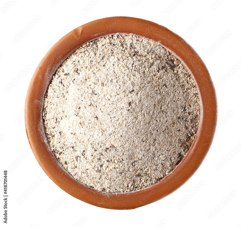 Buckwheat integral flour in clay pot, bowl isolated on white background , top view Buckwheat integral flour in clay pot, bowl isolated on white background , top view
