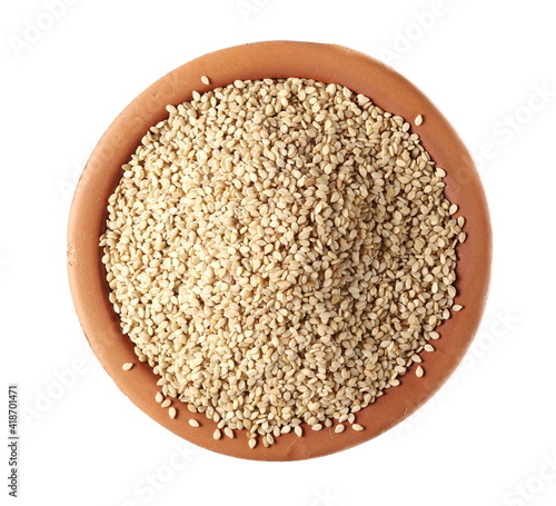 Organic integral sesame seeds in clay pot isolated on white background, top view