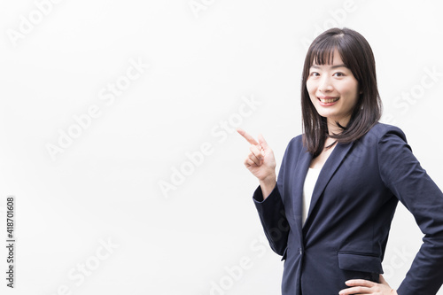 Woman standing with her index finger up (gesture)