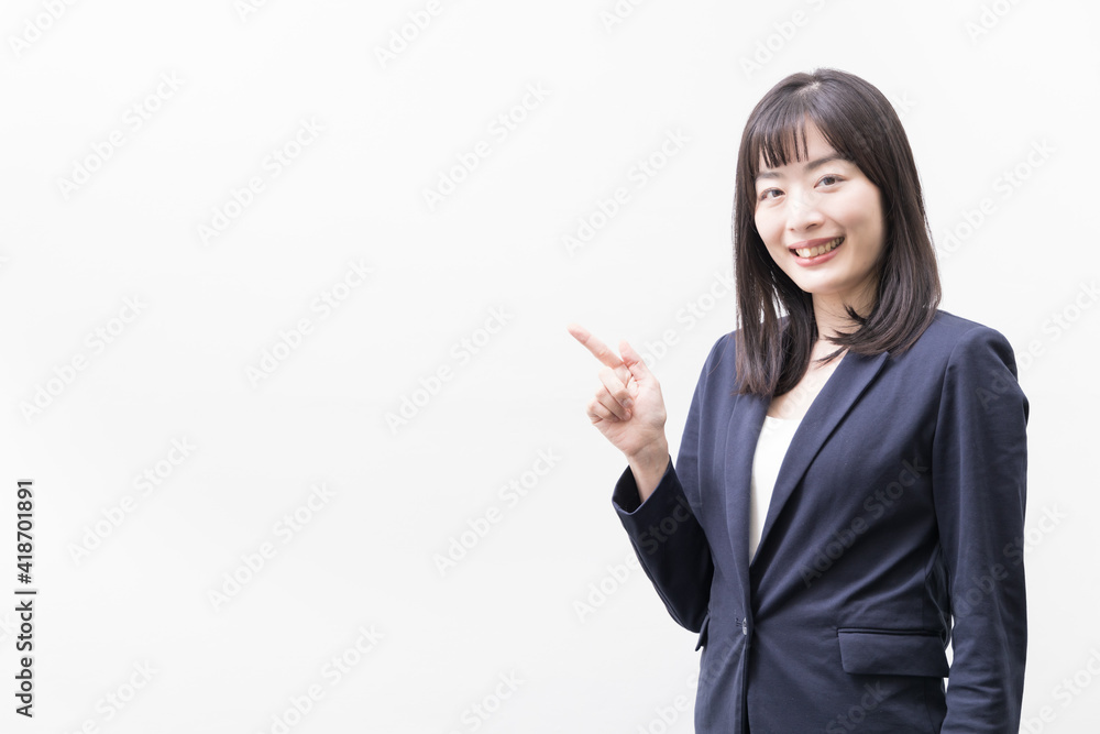 Woman standing with her index finger up (gesture) Woman standing with her index finger up (gesture)