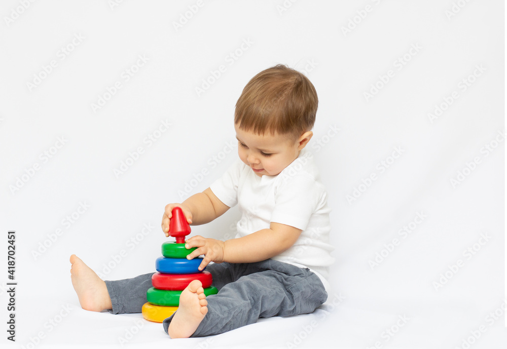 Little boy playing toy isolated on white background Little boy playing toy isolated on white background