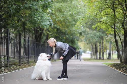 Wallpaper Mural Lovely girl on a walk with a beautiful dog Torontodigital.ca