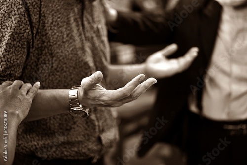 Hand Praying and Praise at Church. selective focus
