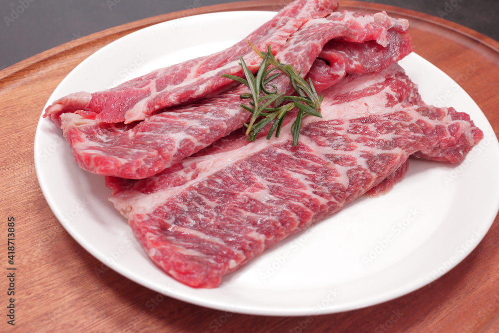 Fototapeta premium fresh raw meat on a white plate