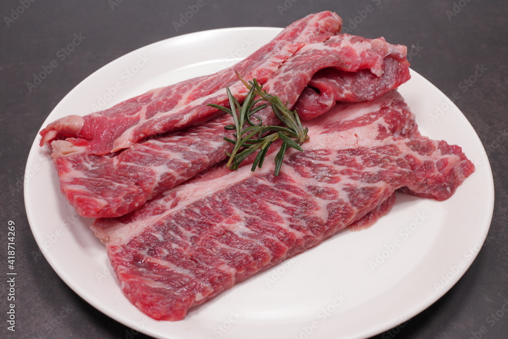 fresh raw meat on a white plate fresh raw meat on a white plate
