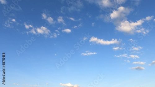 Slow Motion 4k cinemagraph b-roll TimeLapse, Beautiful sunny clear blue sky background with puffy fluffy white cloud n cumulus cloudscape in tropical summer n spring sunlight n sun ray at sunshine day