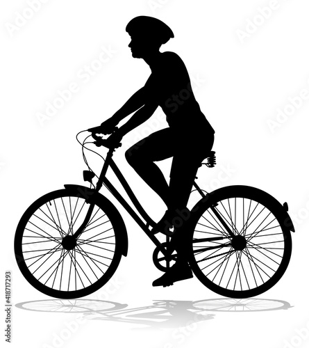 Bicyclist riding their bike and wearing a safety helmet in silhouette © Christos Georghiou