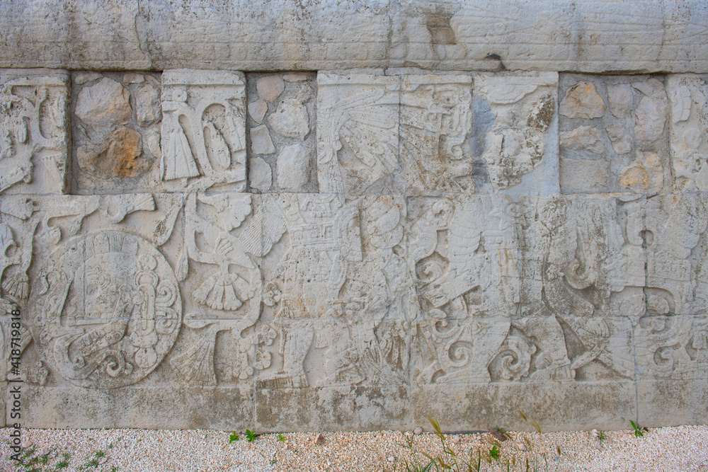 Stone carving at Juego de Pelota Ball Court at Chichen Itza archaeological site in Yucatan, Mexico. Chichen Itza is a UNESCO World Heritage Site.