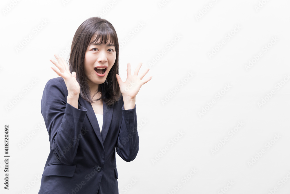 Woman standing and surprised by something Woman standing and surprised by something