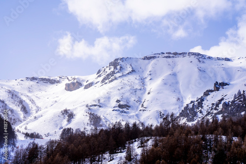 Winter landscape of mountains and sunny day. French alpines.