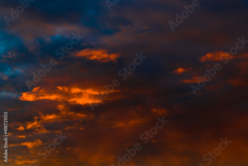 Beautiful sunset. Orange clouds in the sky  background 