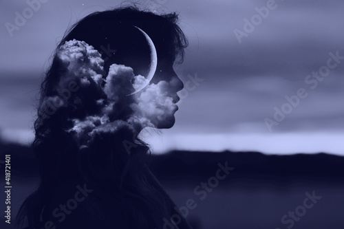 Beautiful woman profile silhouette portrait with moon and clouds in her head