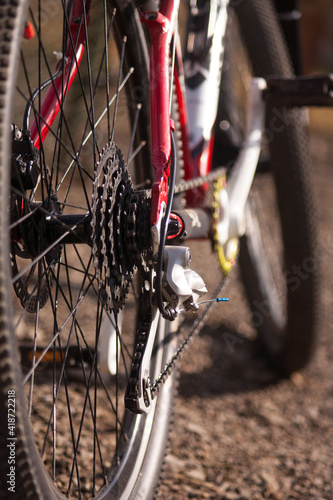 Bicycle repair shop, technical maintenance of a bike. Close-up view of a breaking system and transmission of a cross country bicycle in service shop.  