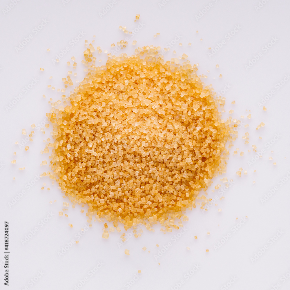 cane brown sugar on a white acrylic background cane brown sugar on a white acrylic background