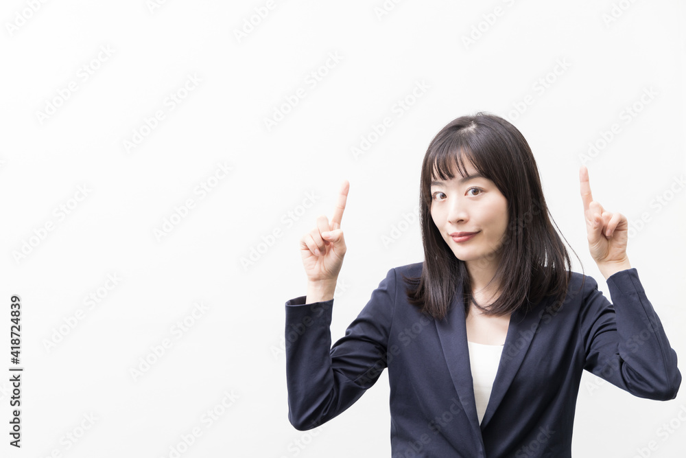 Woman standing with her index finger up (gesture) Woman standing with her index finger up (gesture)