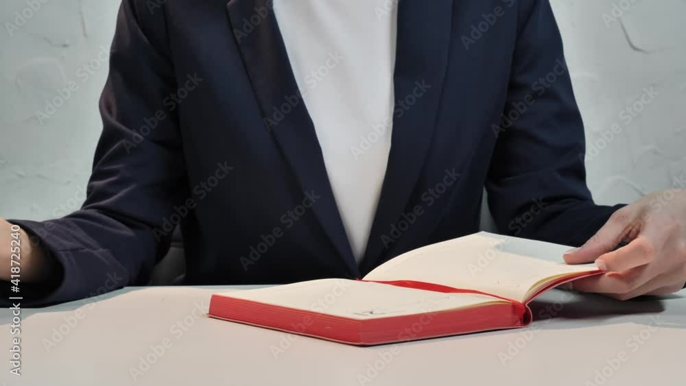 business girl taking notes in her workbook business girl taking notes in her workbook