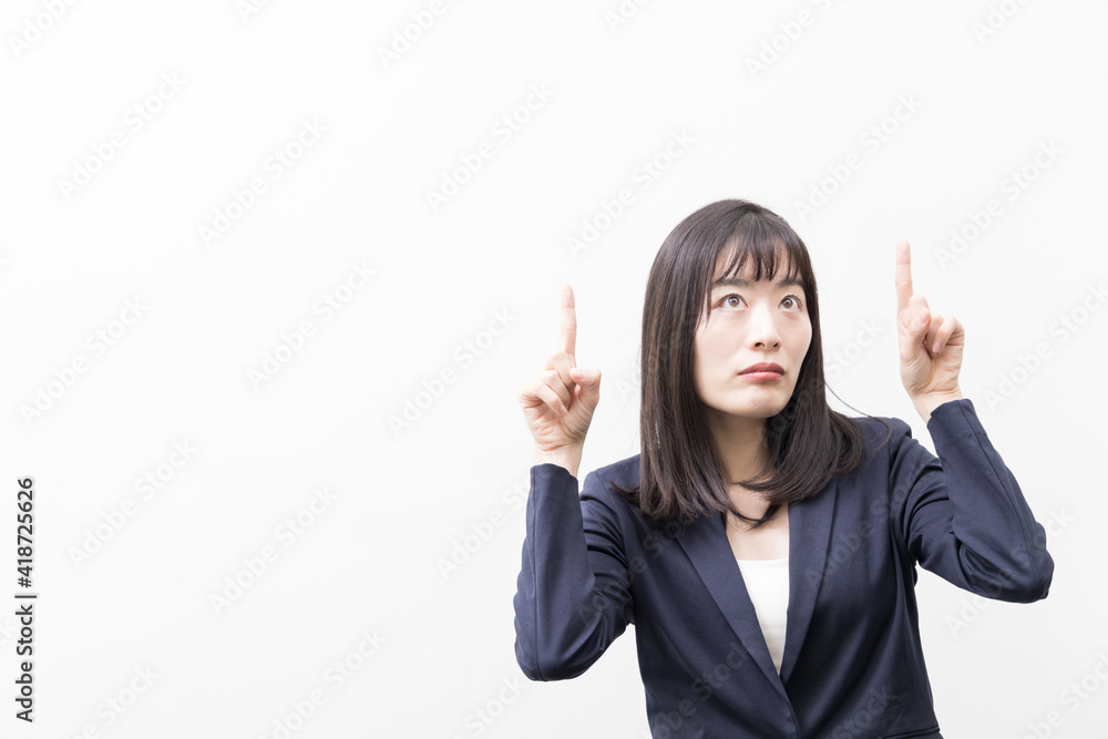 Woman standing with her index finger up (gesture) Woman standing with her index finger up (gesture)
