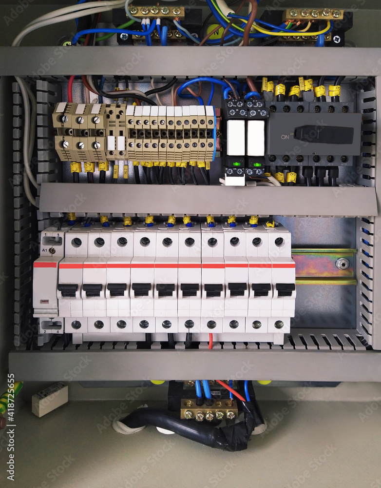 Switchboard with many switches and cables. Power shield lighting. electric connection wires of fuse switch box. Mobile photo