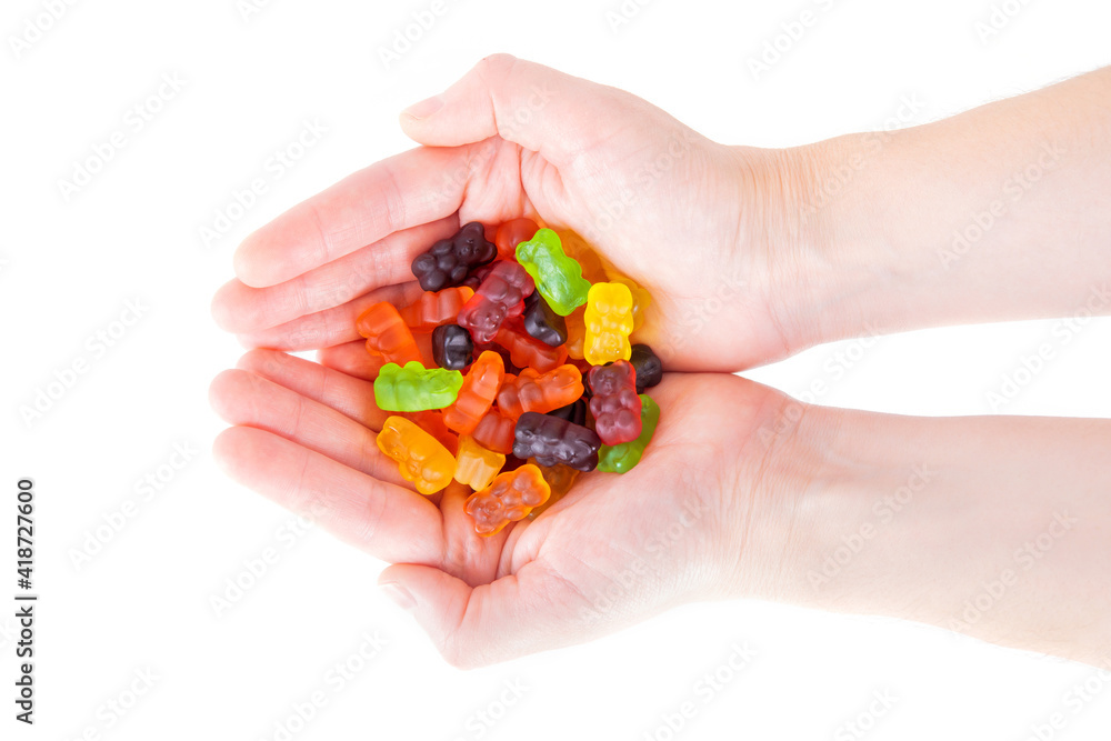 Gummy bear candies in female hands Gummy bear candies in female hands