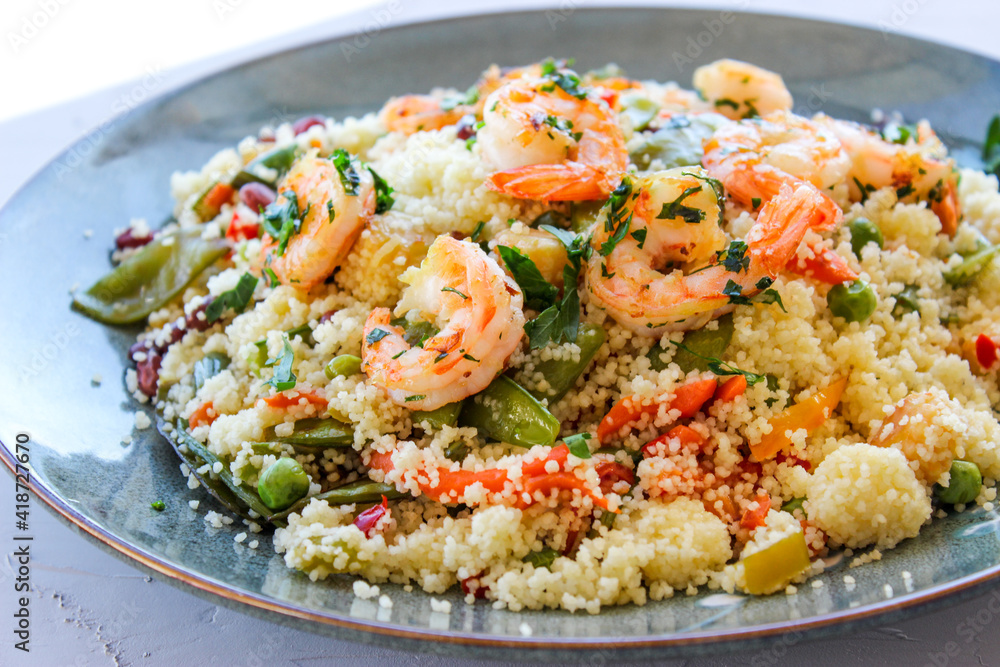 Couscous with vegetables and king prawns. Couscous with vegetables and king prawns.