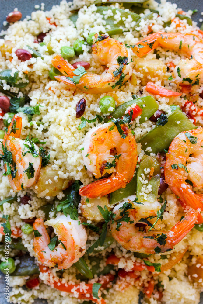 Couscous with vegetables and king prawns.